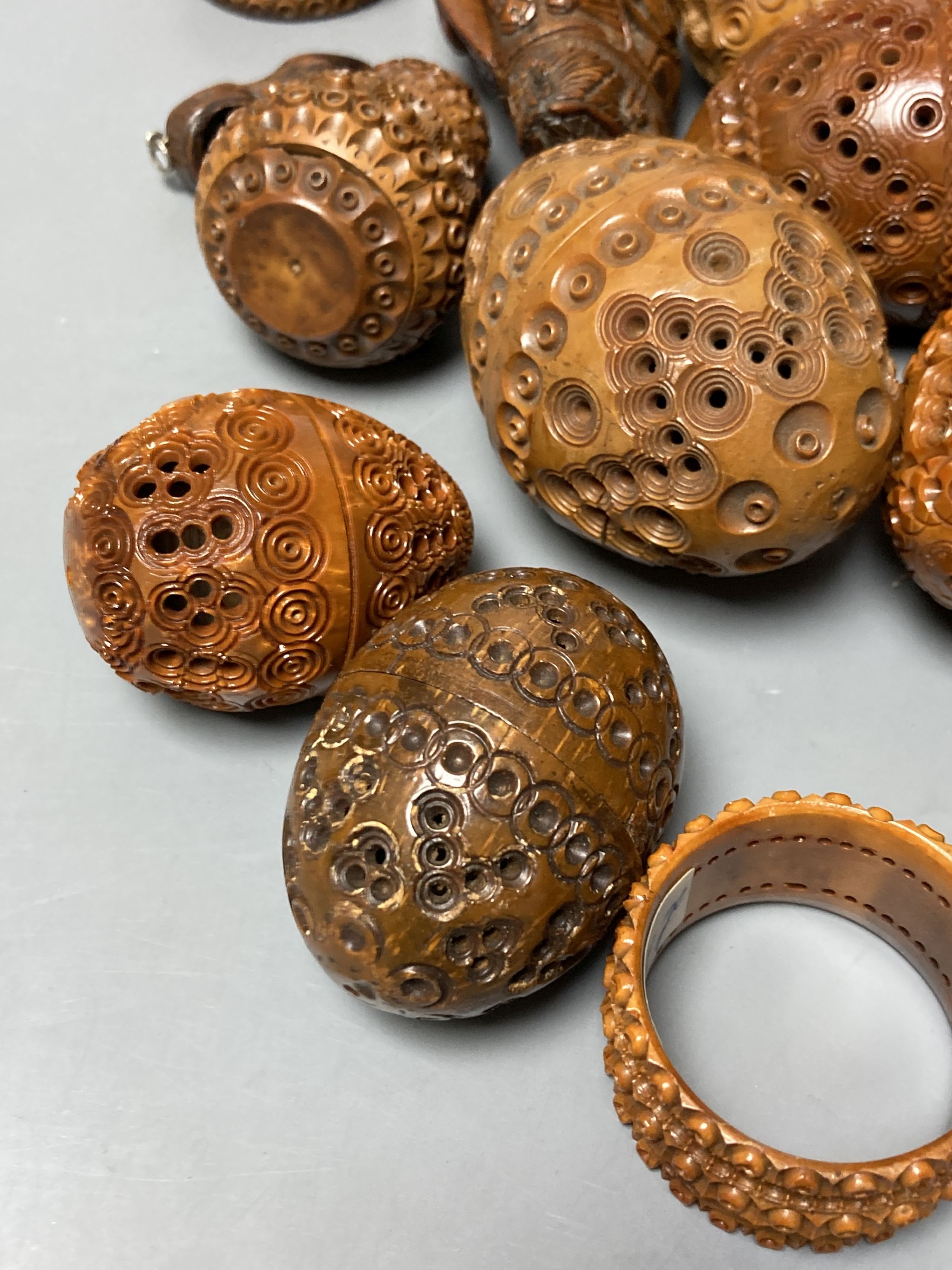 A quantity of coquilla nut carvings